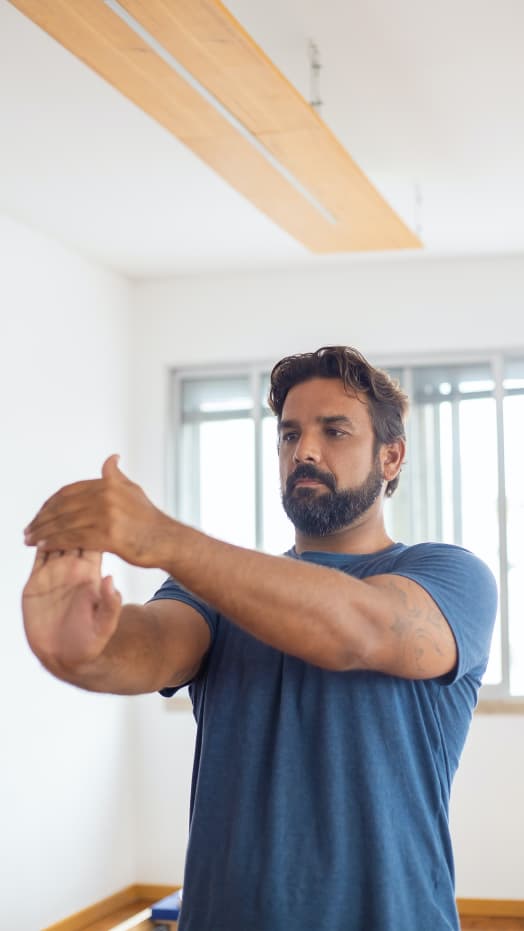 man stretching hand