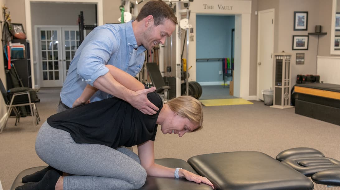 physical therapist working with patient