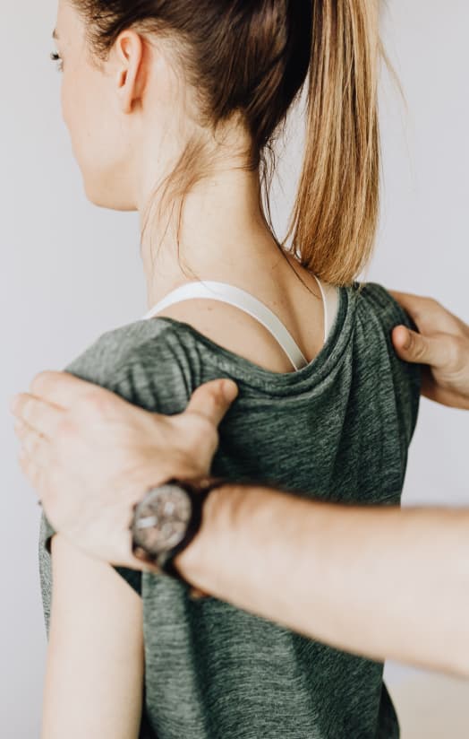 physical therapist working with patient