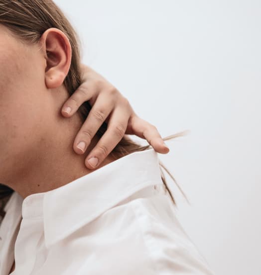 person holding their neck