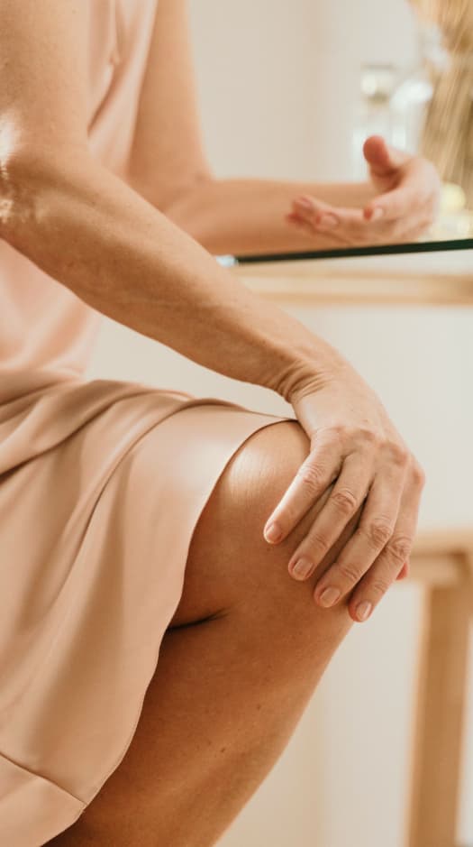 person holding knee