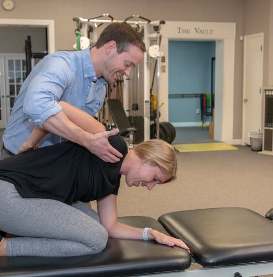 physical therapist working with patient