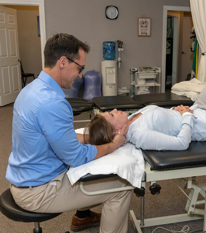 physical therapist working with patient