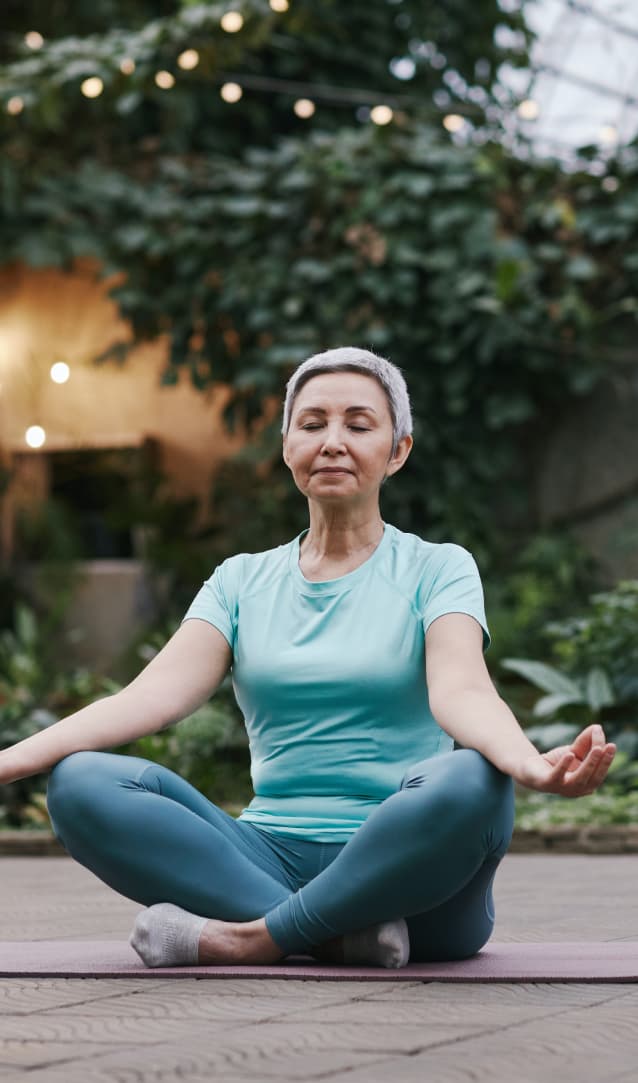 elderly woman doing yoga