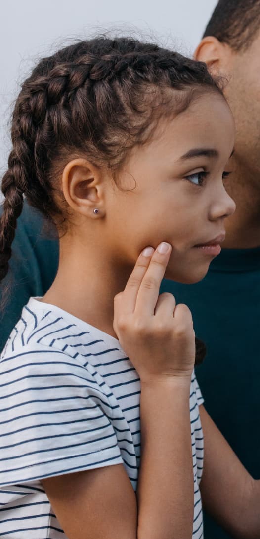 young girl touching jaw