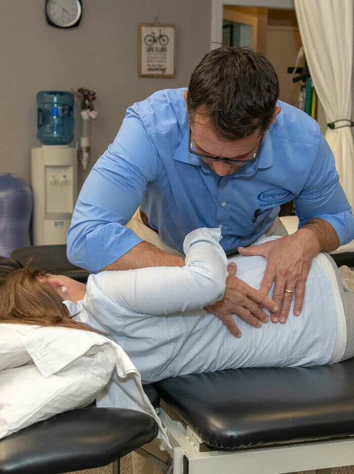 physical therapist working with patient