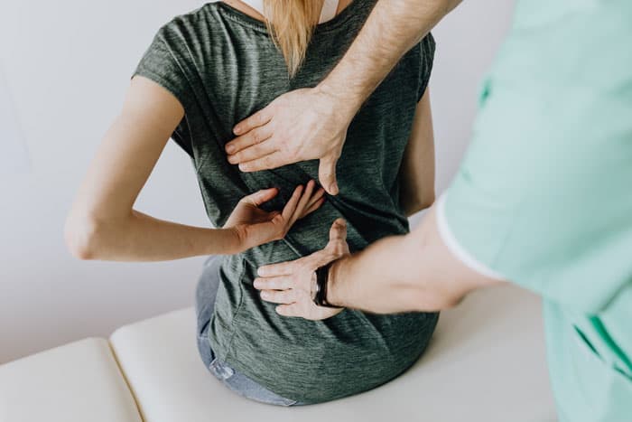 physical therapist working with patient