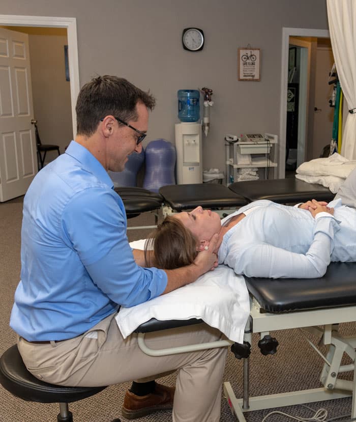 physical therapist working with patient