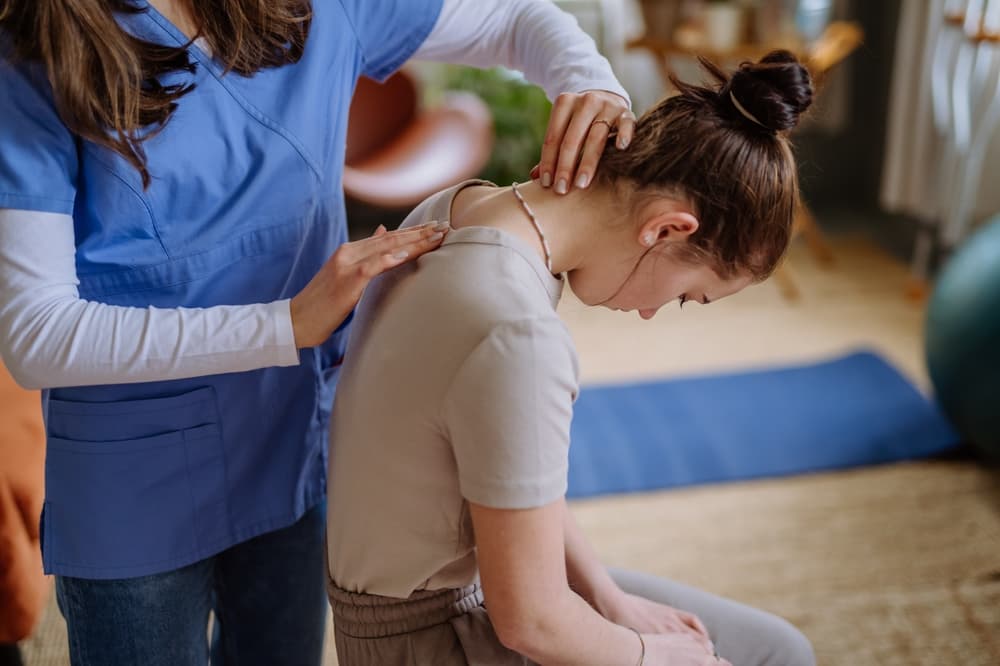 a girl getting her spine checked out